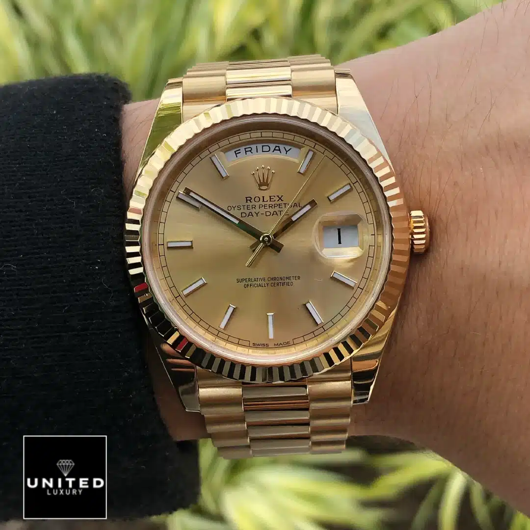 Day-Date 40 Gold Replica 5 Rolex Day-Date 40 228238-0003 Champagne Dial Stick Indices Replica on his arm