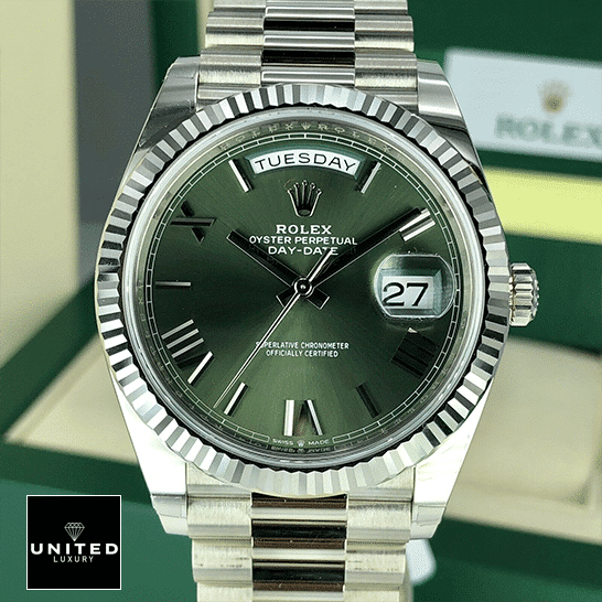 Rolex Olive Green Replica 10 Rolex Day-Date Olive Green 228239 Replica Rolex Box in front of