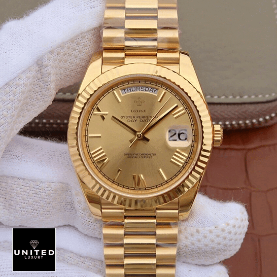 Rolex Day-Date II 228238-0007 KW Yellow Gold Champagne Dial Replica 4 Rolex Day-Date II 228238-0007 Fluted Bezel Replica on is hand