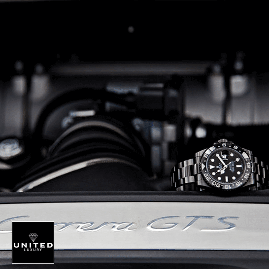 Rolex Blaken GMT-Master II 116710 DLC-PVD Replica 5 Rolex Blaken GMT-Master II 116710 Black Oyster Replica on the black table