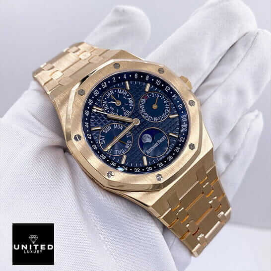 AP Rose Gold Blue Dial Replica 1 Audemars Piguet Gold Blue Dial Replica on the white glove hand