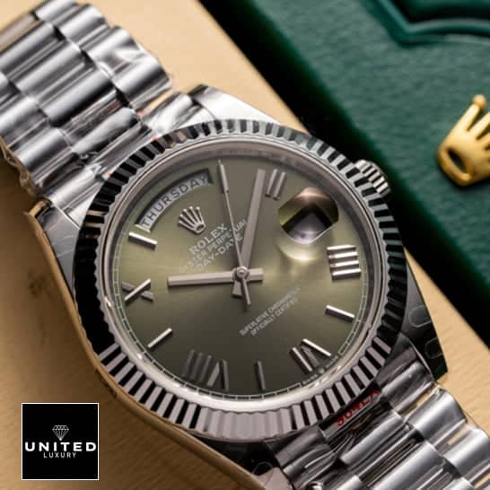 Rolex Olive Green Replica 1 Rolex Day-date 228239-0033 Olive green dial replica above the rolex box