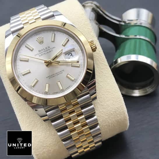 Yellow Gold Datejust Replica 2 Rolex Datejust 41 126303-0002 Replica watch on cushion on the table