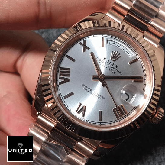 Rolex Day-Date 228235 AR Rose Gold Wrapped Rhodium Dial Replica 1 Rolex day-date roman wihte dial replica on the hand