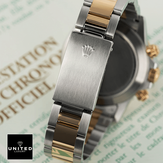 Rolex Daytona Cosmograph Yellow Gold Champagne Dial 16523 Replica 6 Rolex Daytona S.Steel Two Tone Bracelet Fold Clasp 16523 Replica on the table