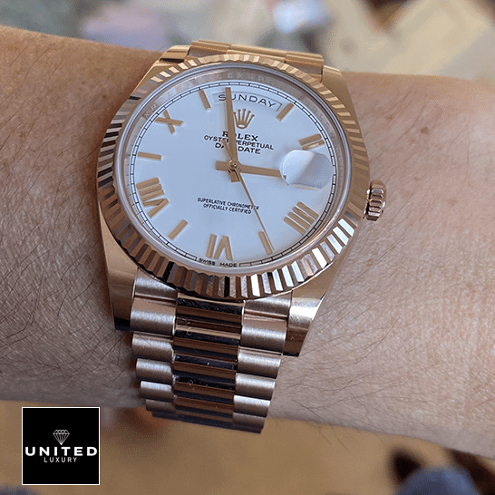 DayDate President 118235 Replica 4 Rolex Day-Date President 118235f-0024 Rose Gold Fluted Bezel Replica on his arm