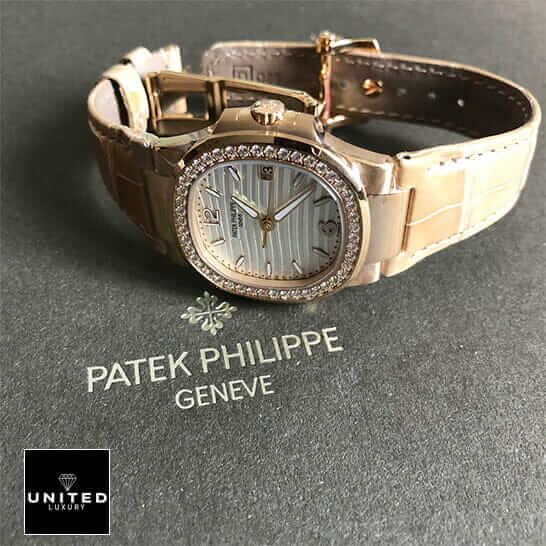 Patek Philippe Nautilus 7010R-011 Replica 2 Patek Philippe 7010 Diamond Bezel Leather Bracelet Replica on the grey carpet