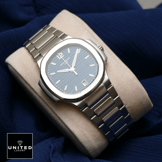 Patek Philippe Nautilus Ladies Blue Replica 1 Patek Philippe Nautilus 71181A-001 Steel Bezel Replica on the stand blue background