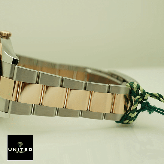 Rolex Datejust 126331-0013 Mother Of Pearl Dial Replica 4 Rolex Datejust 41 126331-0013 Two Tone Oyster Bracelet Replica on the table