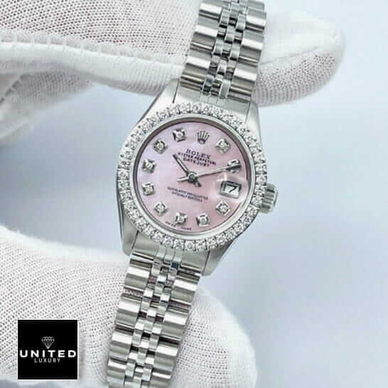 Rolex Datejust 126234 Diamond Bezel Pink Dial Replica 5 Rolex Datejust Diamond Bezel & Dial Replica between the fingers