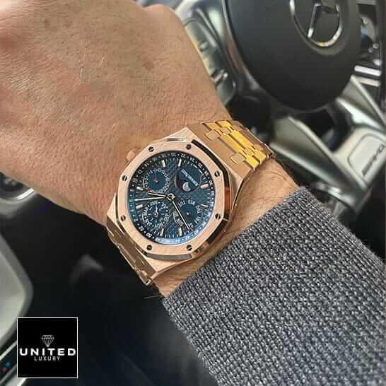AP Rose Gold Blue Dial Replica 4 Audemars Piguet Royal Oak Blue Dial Gold Case Replica on the man wrist in car